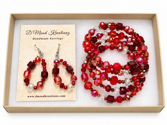 Red crystal beaded wrap bracelet and matching drop earrings displayed in a gift box by D'Mood Kreationz.