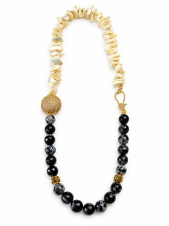 Everything handcrafted necklace featuring cream shell chip beads, black and gray marbled beads, and decorative gold-tone accents.